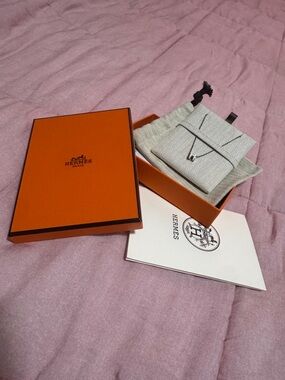 Hermes Orange Box with Beige Drawstring Pouch and Silver Necklace Pendant